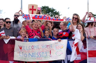 England fans gathered outside Southend Airport to greet the Lionesses (Yui Mok/PA)